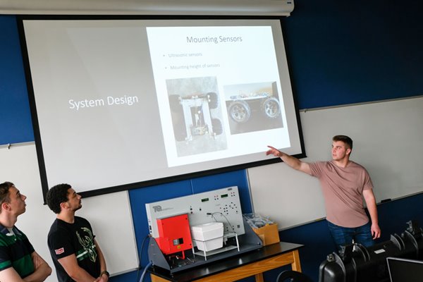 Student presents his mechatronic robotics final project