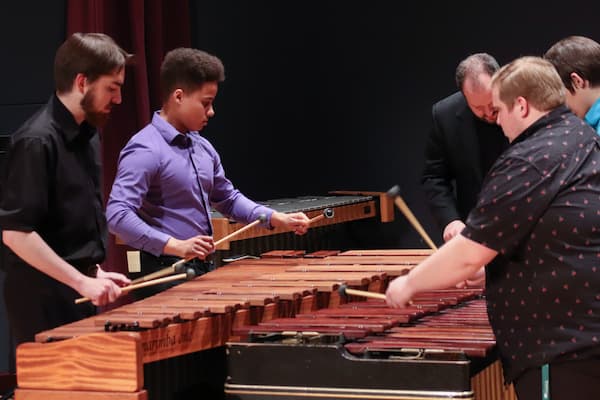 Students practice for percussion ensemble