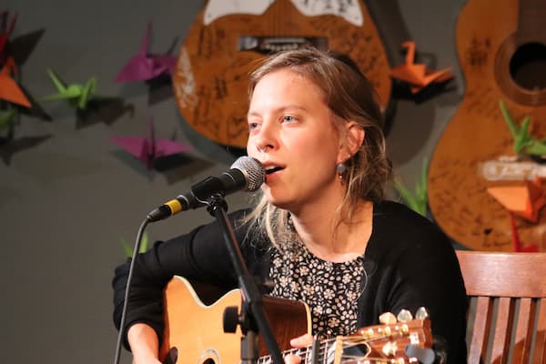 Student sings and plays guitar for audition