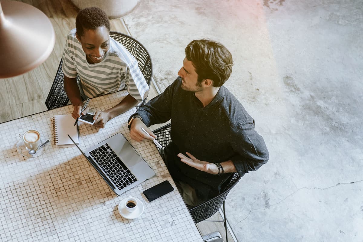 Two colleagues discussing their work