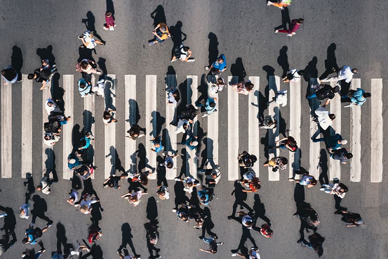 people crossing street seen from above