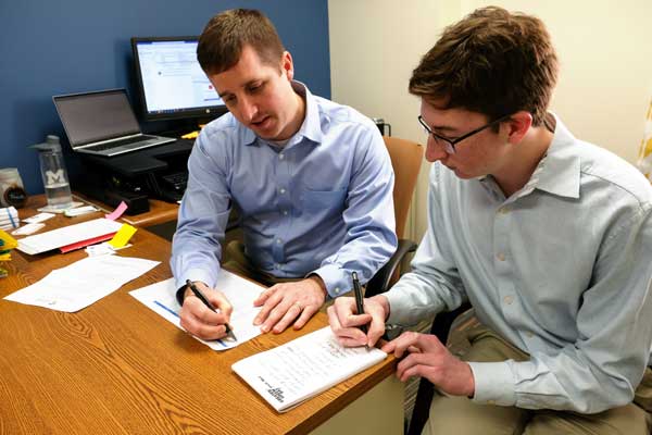 Students meet one on one to learn financial counseling