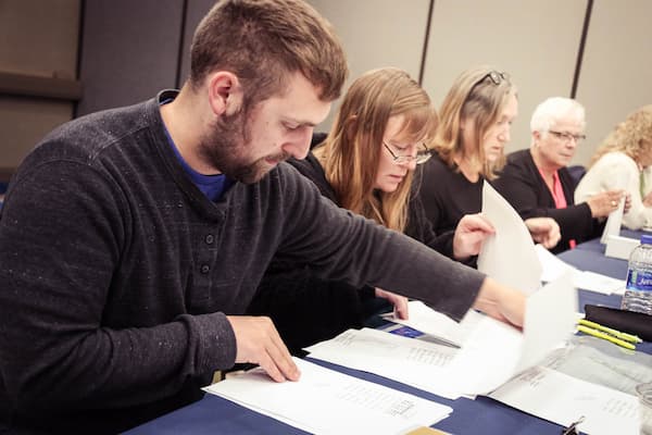 Volunteers look over voter registration papers