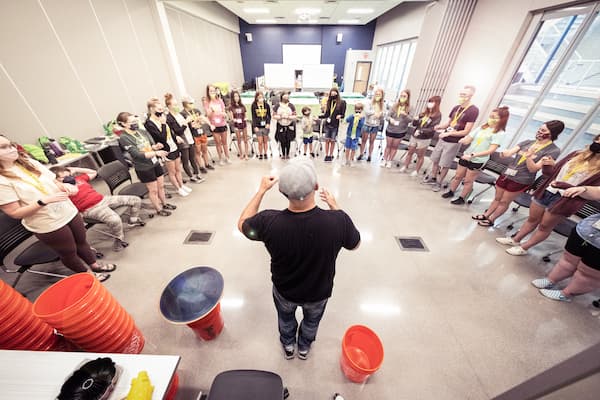 Psych Students and Campers gather in a circle