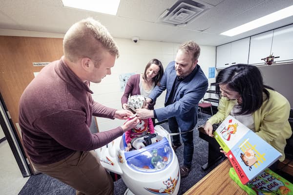 Teachers and students preform eeg study on child