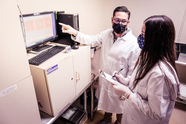 Teacher and student in lab