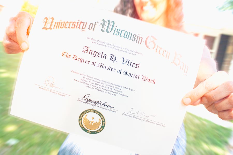 Student holding diploma