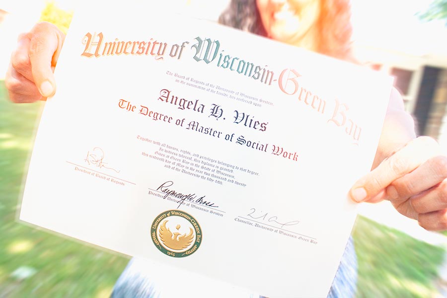 Student holding diploma