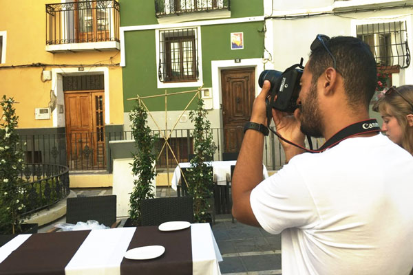 Male student takes photograph while abroad