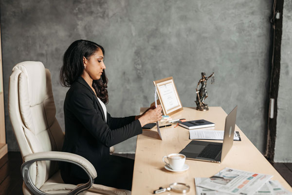 Female lawyer works at desk