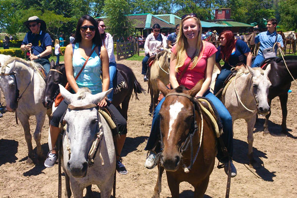 Two female students on horse back