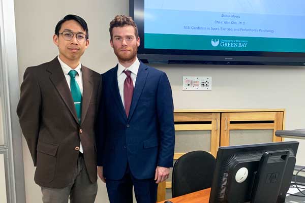 Beaux Myers takes photo with Professor Alan Chu