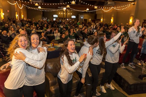 UWGB girls basketball team celebrates a tournament selection