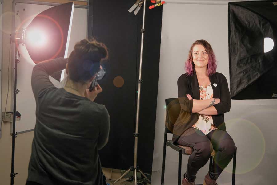 Student poses for professional headshot