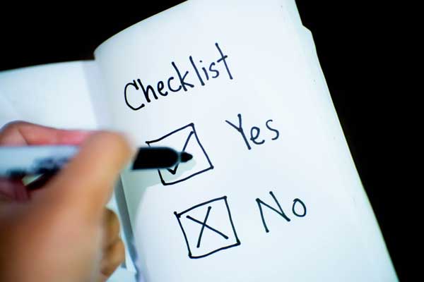 Student crossing off tasks on checklist