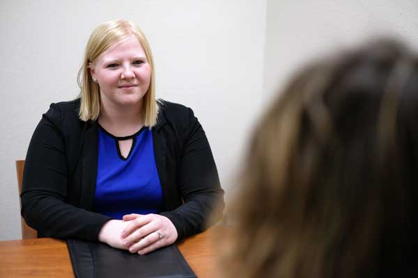 Student interviewing with campus staff