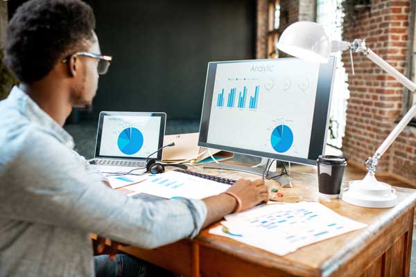 African american employee works on analytics