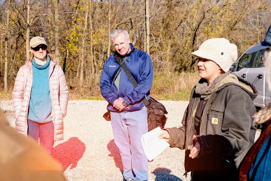 UW-Green Bay campus communty volunteers gathering to plant the wiquiock creek natural area