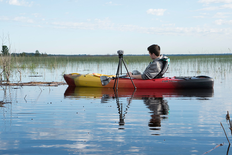 Student kayaking to do field research