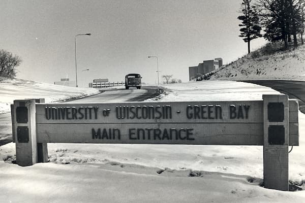 Early photo of a VW van of the UWGB Campus