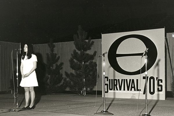 Photo of a college woman speaking at an ecology rally at the first earth day
