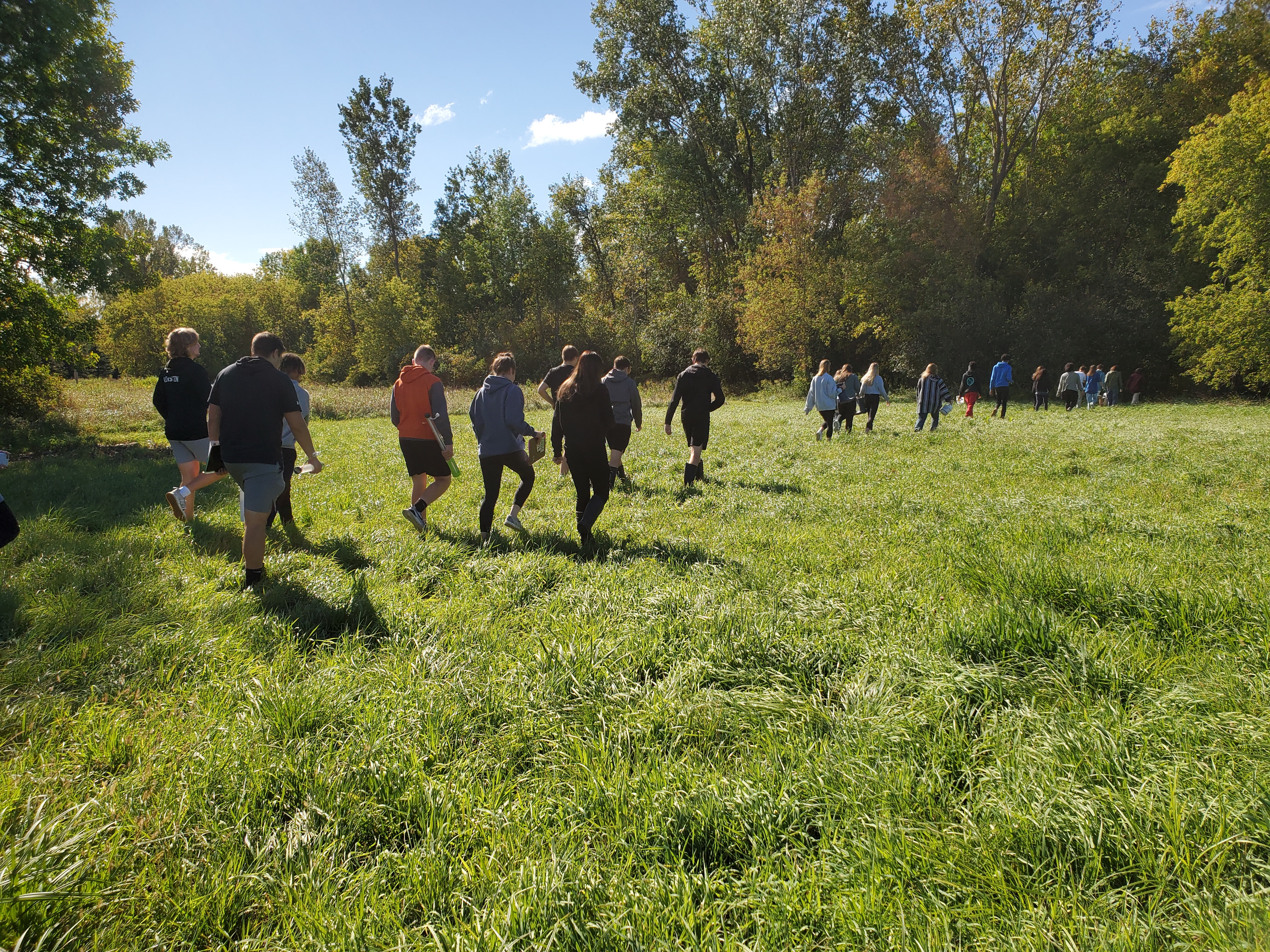 Students walking in a field