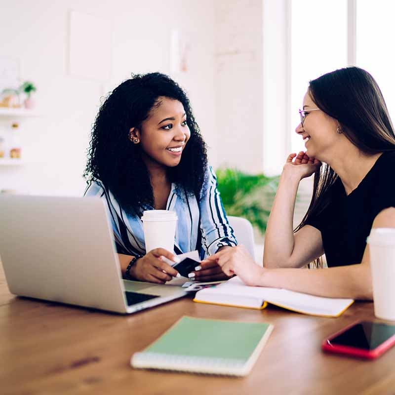 two women discussing work