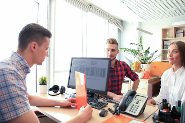 Male accountant meets with clients