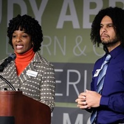 two people giving a speech