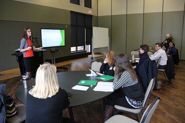 presenter showing powerpoint slide