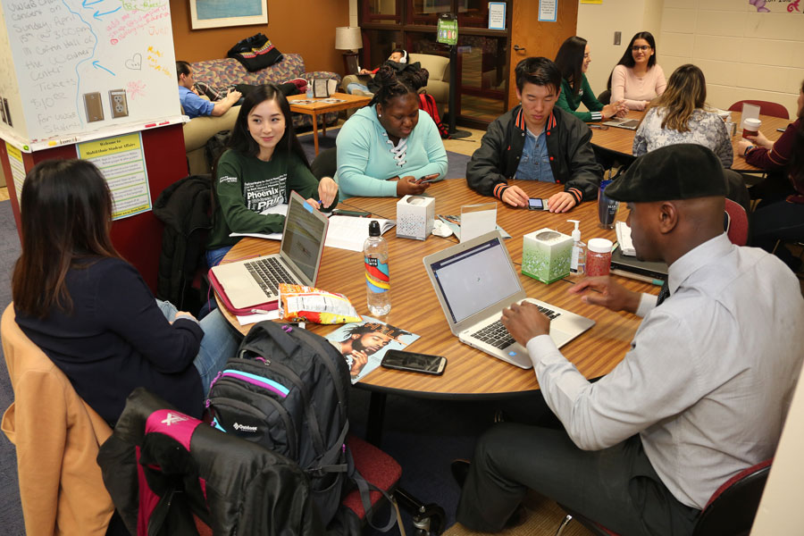 Group of multi-ethnic students study and hang out in lounge