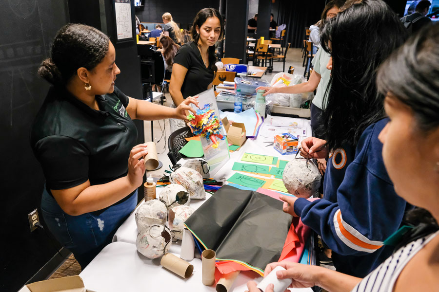 Students creating Hispanic/Latinx heritage art projects during the Arte y Antojos event