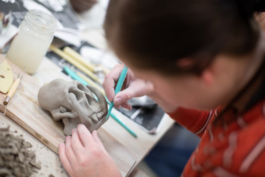 Student works on sculpting in ceramics class
