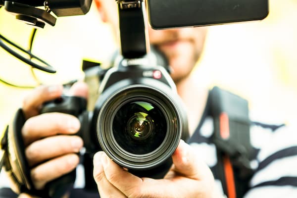 Close up of student holding camera