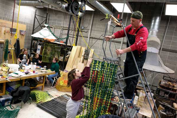 Professor helps student on project