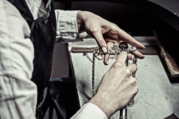 Student works on piece in jewelry studio