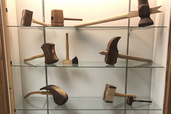 Student carved wooden axes on display