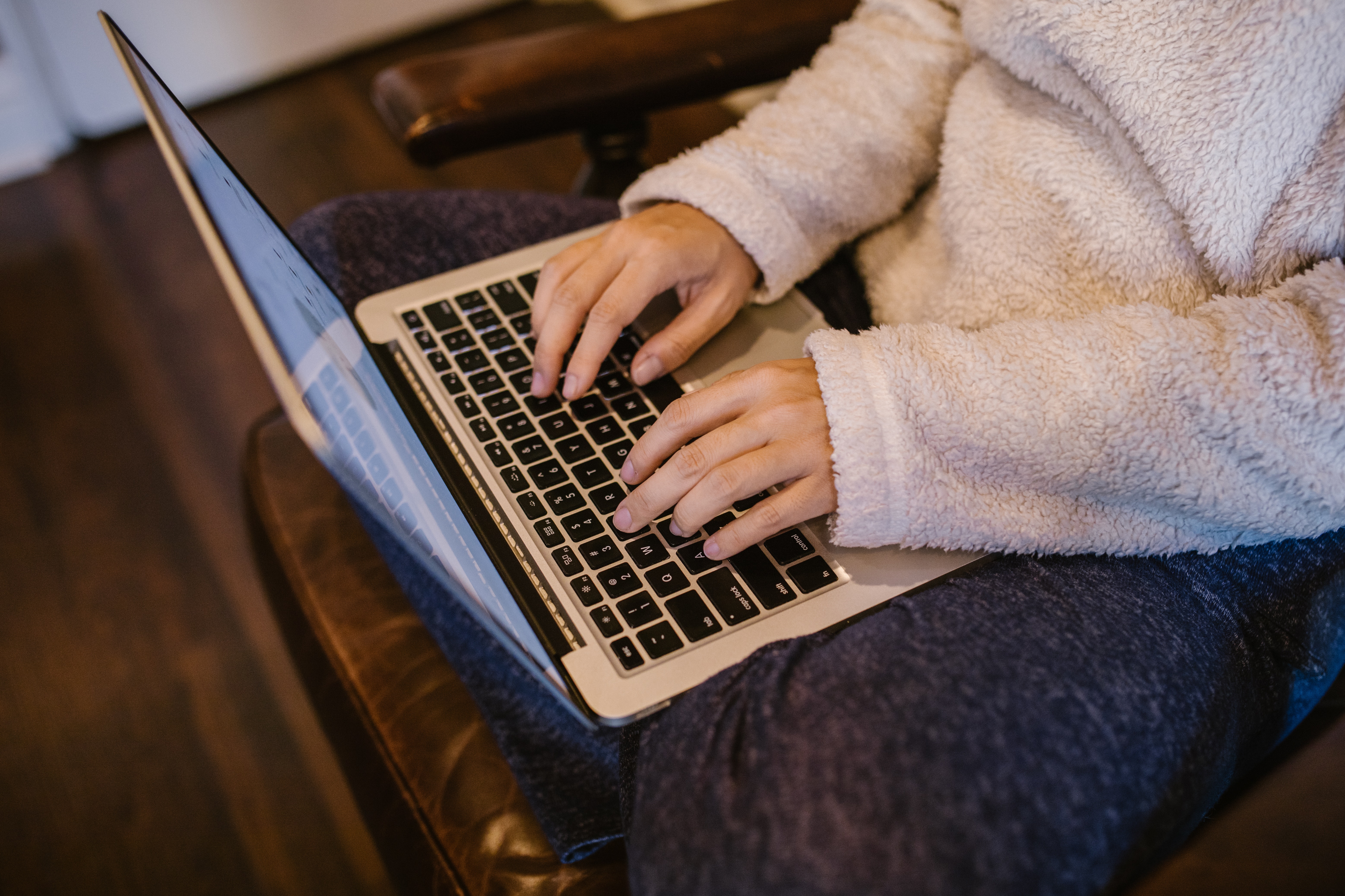 Person typing on laptop