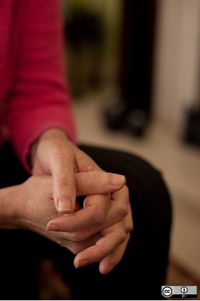Person with folded hands