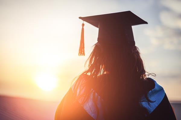 graduate at sunset