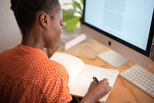 African American female attends online class