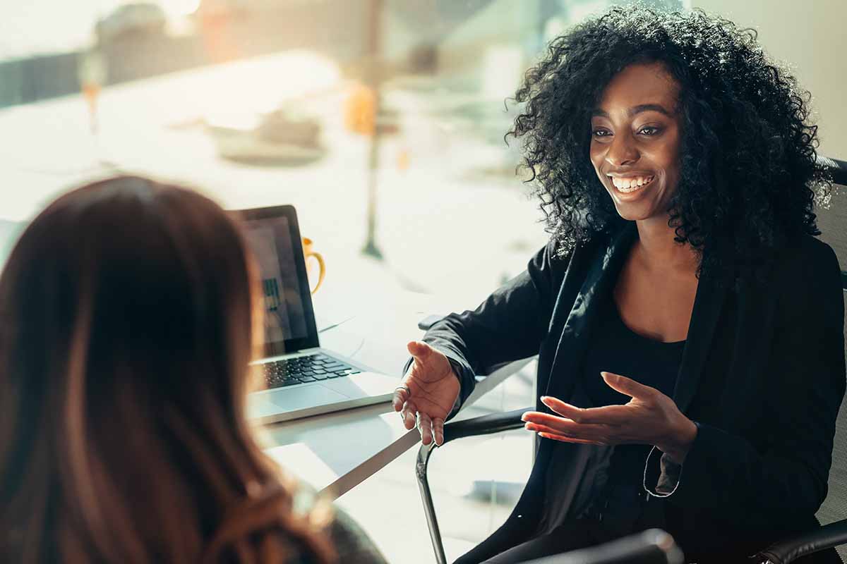 Two Women Business Colleagues Talking