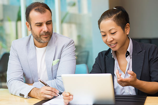 two employees sitting together
