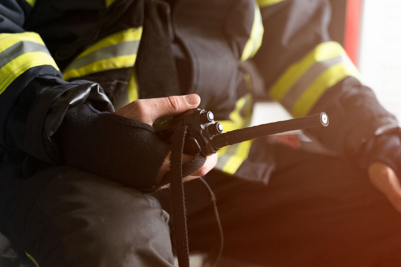 Firefighter holding radio