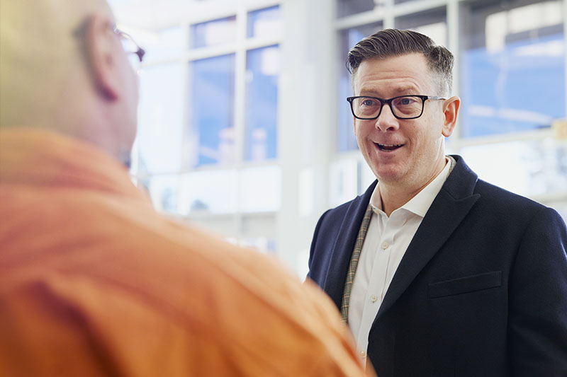 Team leader talking to employee