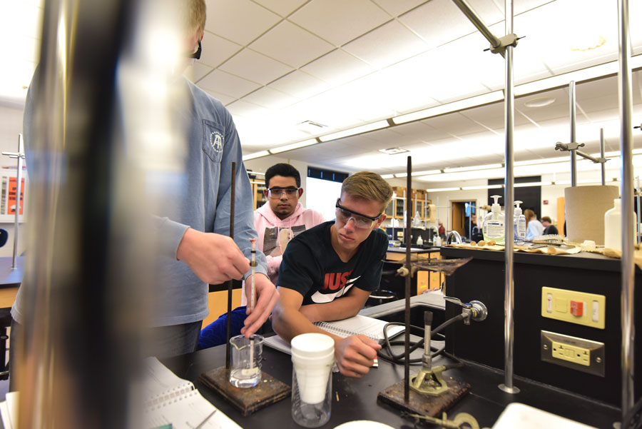 Students measure liquid in beaker