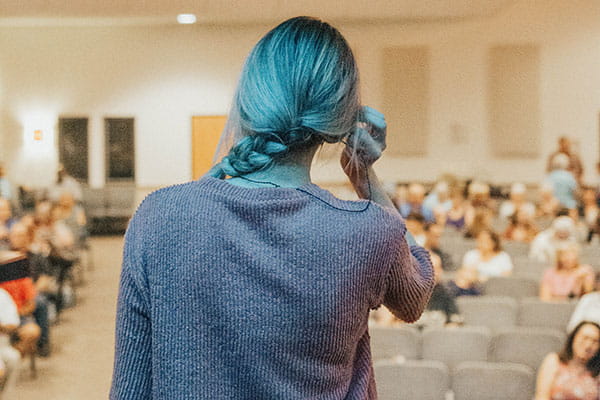 Speaker giving presentation during event