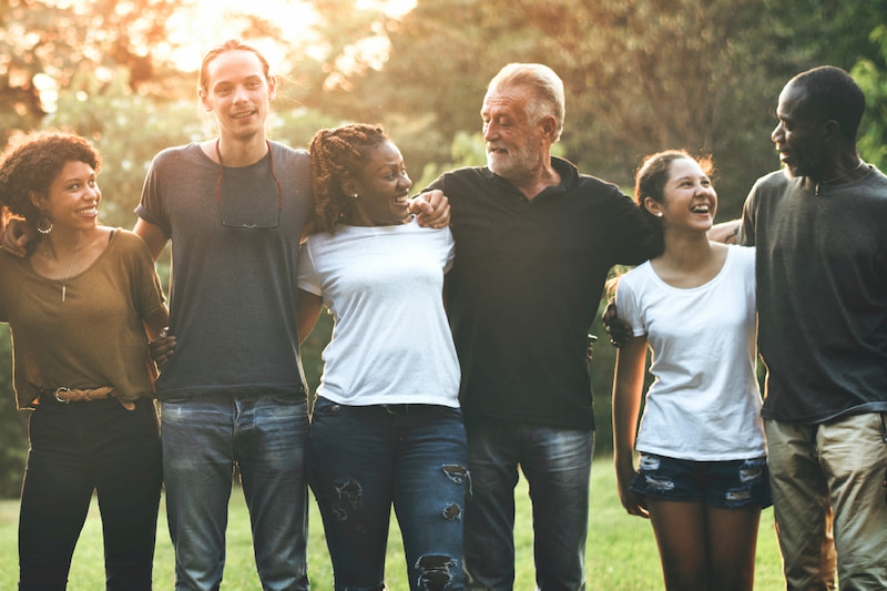 group of people in line holding each other