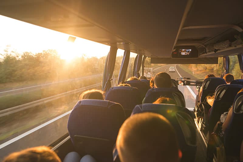 Group of people traveling by bus on a day trip