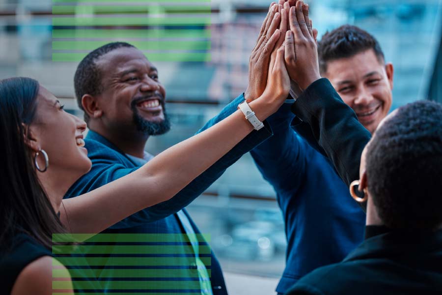 group of coworkers giving each other high fives